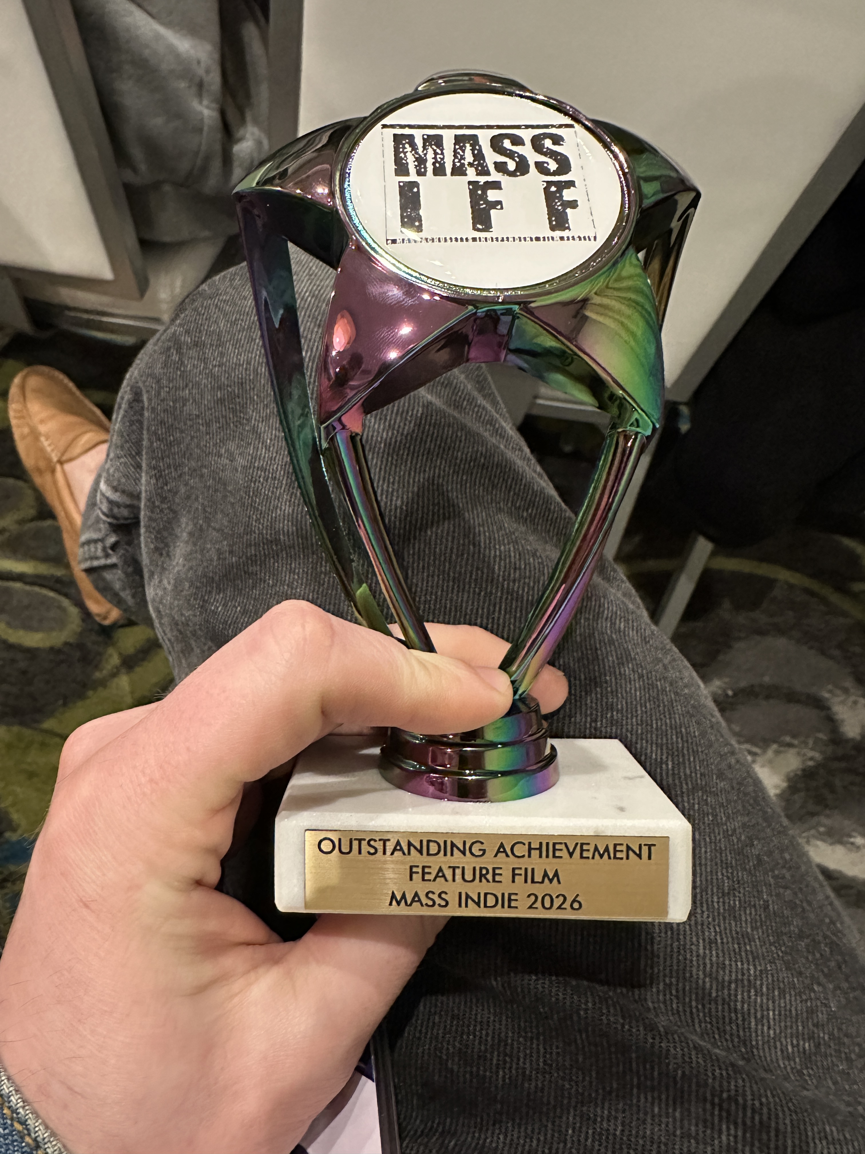 Holding the Outstanding Achievement trophy